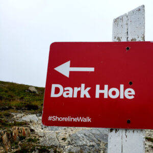 A sign points the way to a somewhere called Dark Hole.