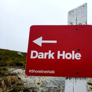 A sign points the way to a somewhere called Dark Hole.